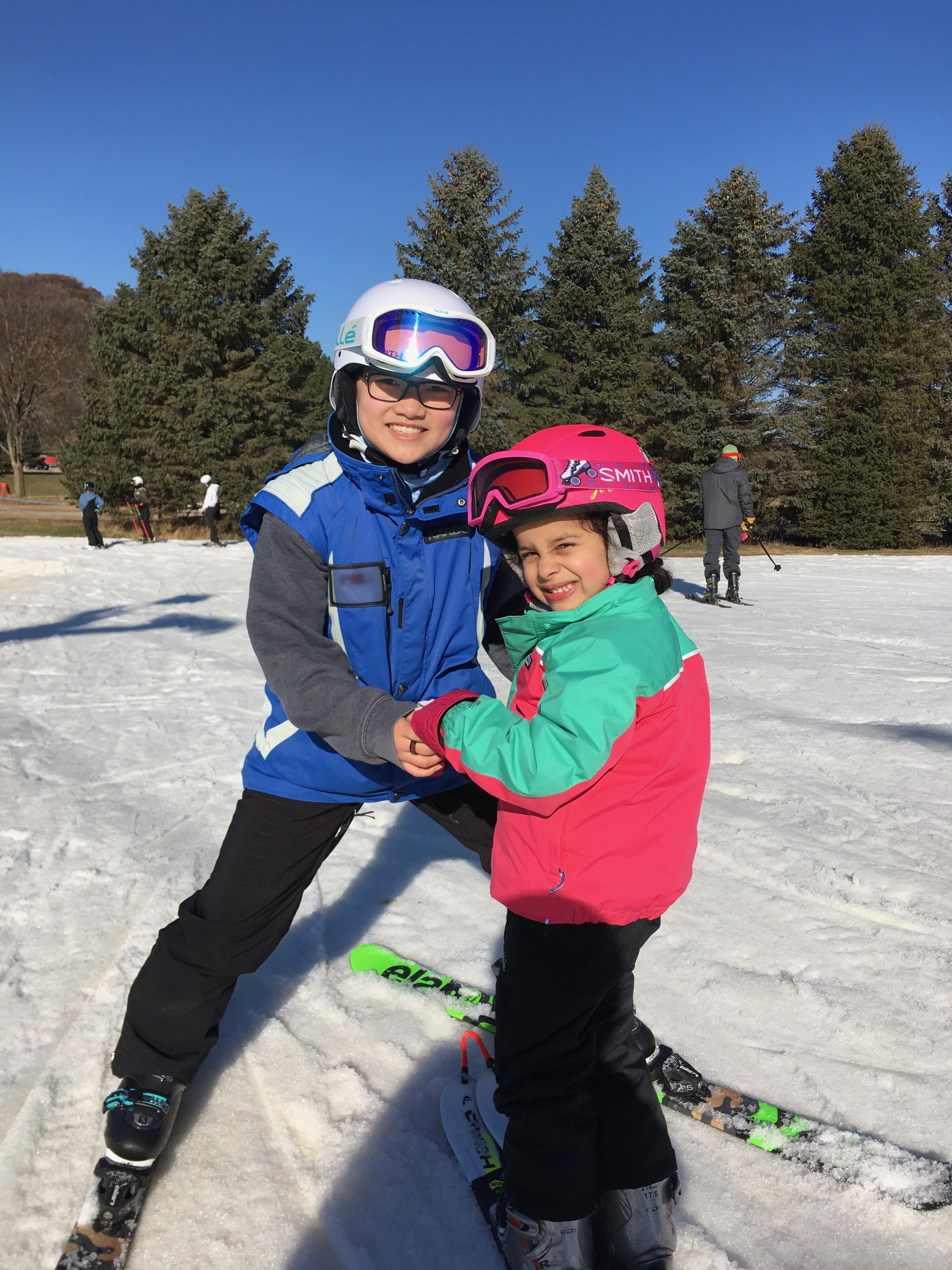 Ski instructor talking to students