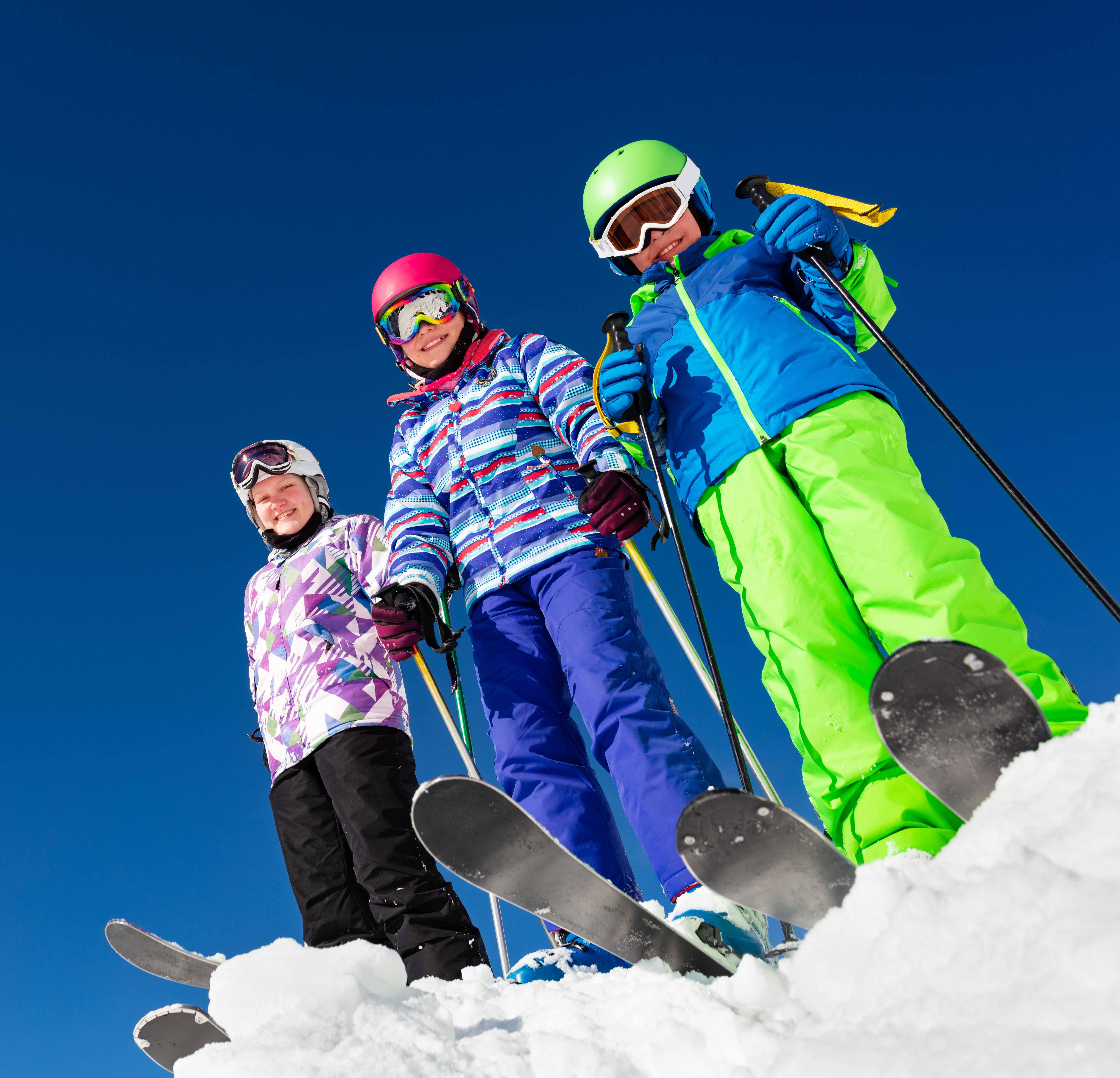 Ski instructor talking to students