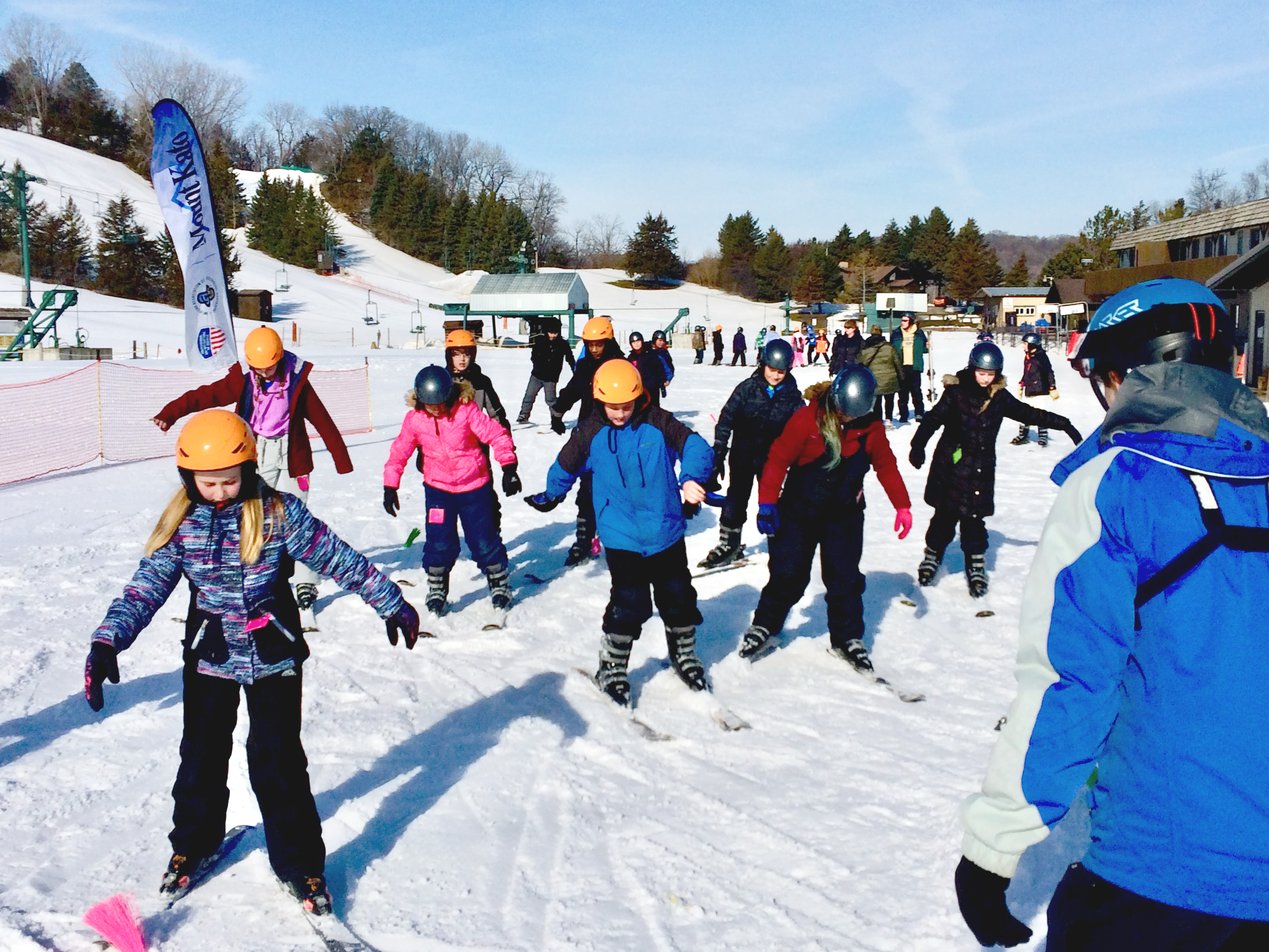 Ski instructor talking to students